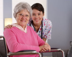 smiling caregiver and elderly woman